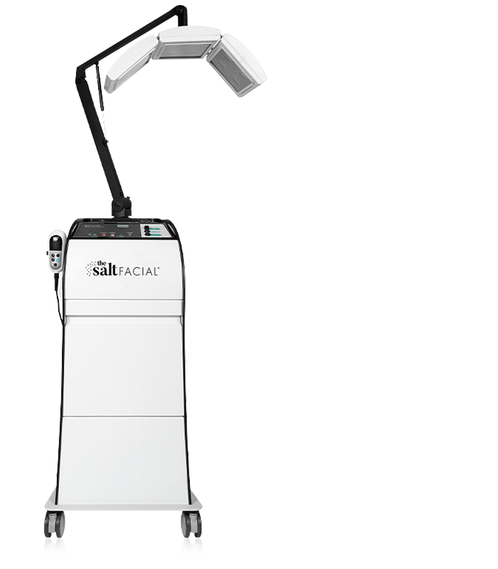 White facial treatment machine with 'The Salt Facial' logo on a white background. It is the best LED device purchase.